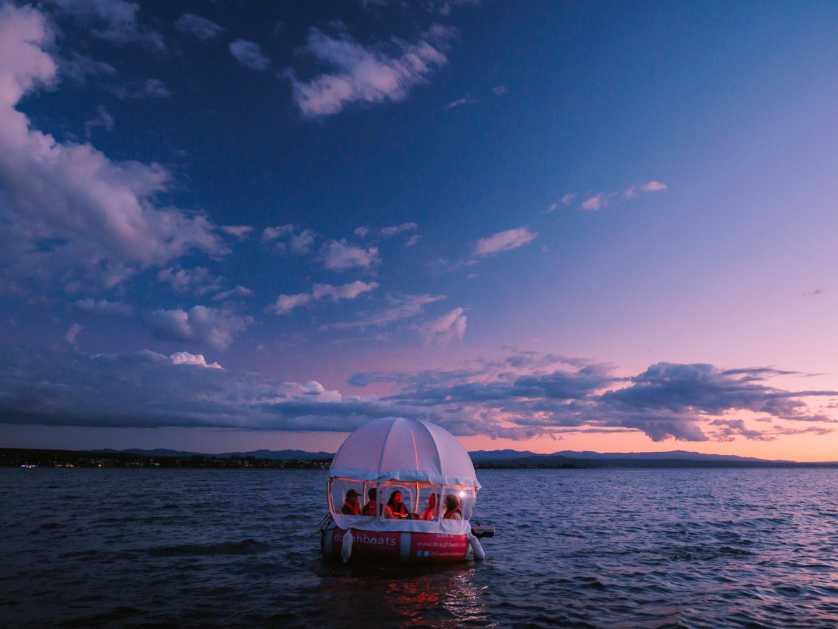 a small boat in a large body of water